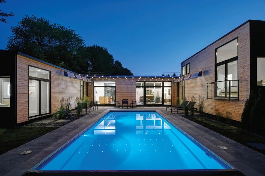 Rectangular Claremont Latham fiberglass pool featuring the vibrant proprietary Sapphire Blue Crystite finish.